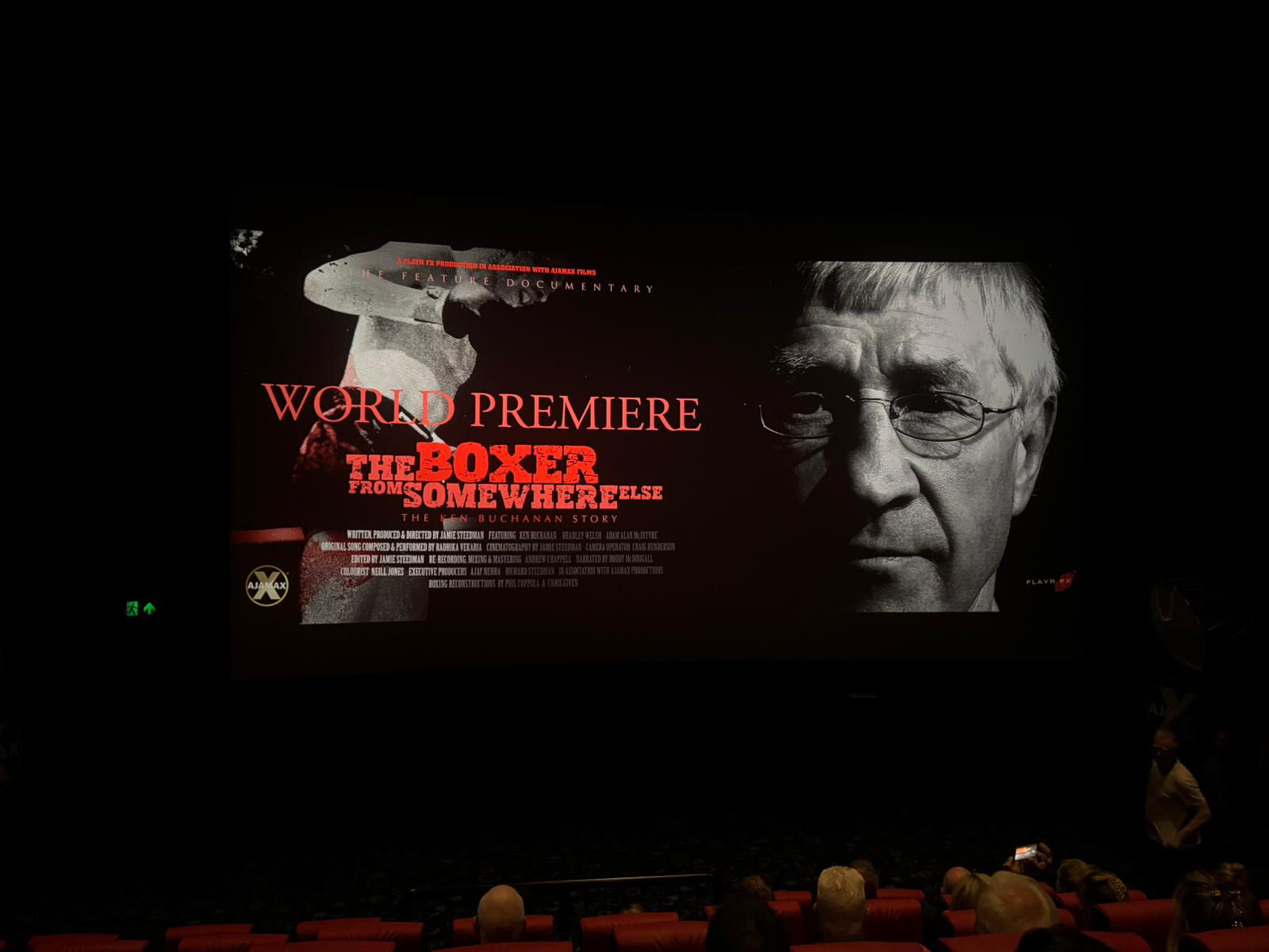 The world premiere holding slide on the cinema screen