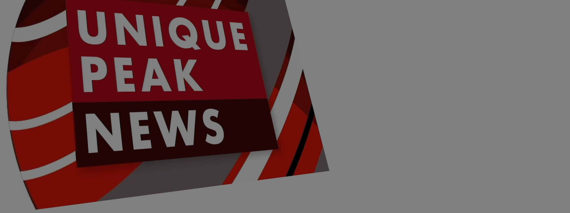 The Unique Peak News title graphic in red and white