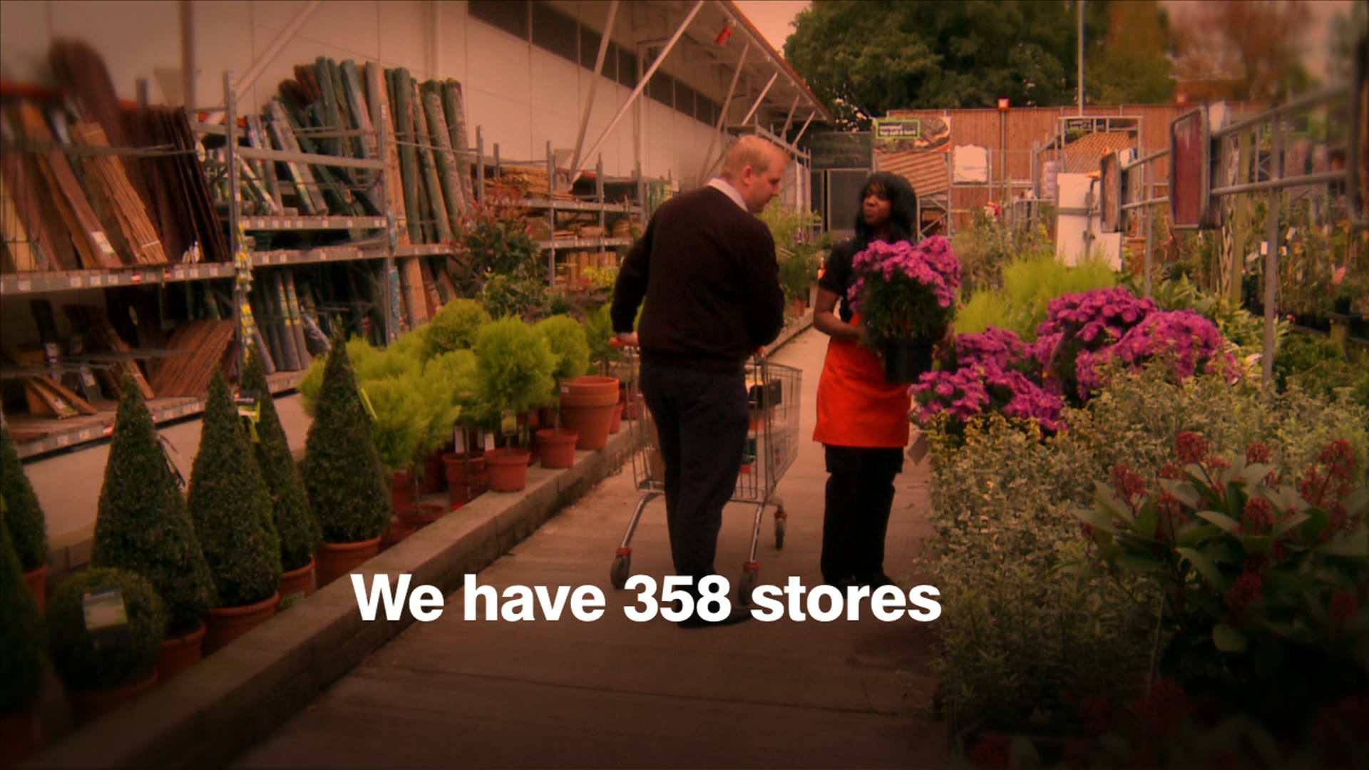 Customers in a B&Q garden centre with the caption “We have 358 stores”